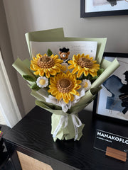 The Golden Trio is a standout bouquet featuring 3 large crochet sunflowers, a graduation bear, and 4–5 accent crochet blooms, all hand-arranged with care. This bouquet brings a burst of sunshine and a heartfelt congratulations to any grad celebration.