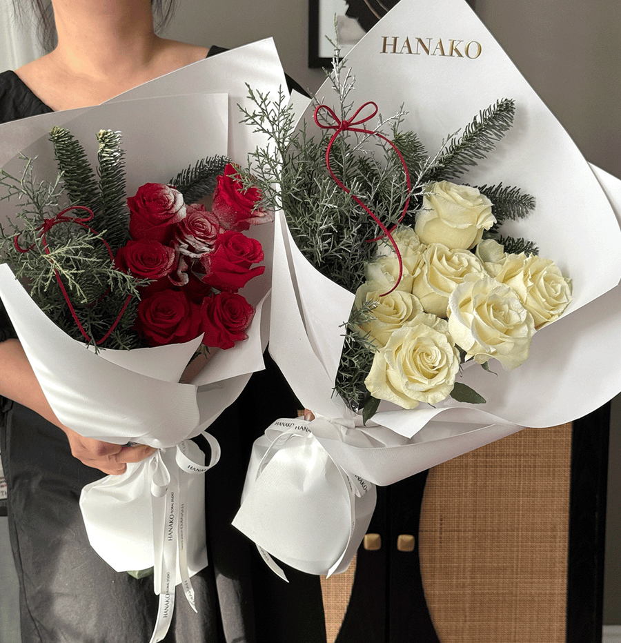 Two bouquets of red and white roses with greenery, one labeled 'HANAKO', held by a person.