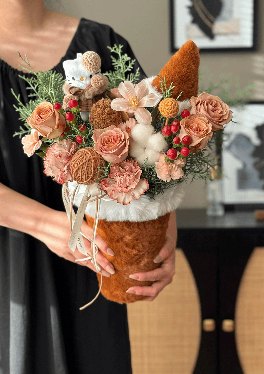 Soft peach tones, warm textures, and playful handcrafted details create a comforting winter aesthetic—cute but elegant.