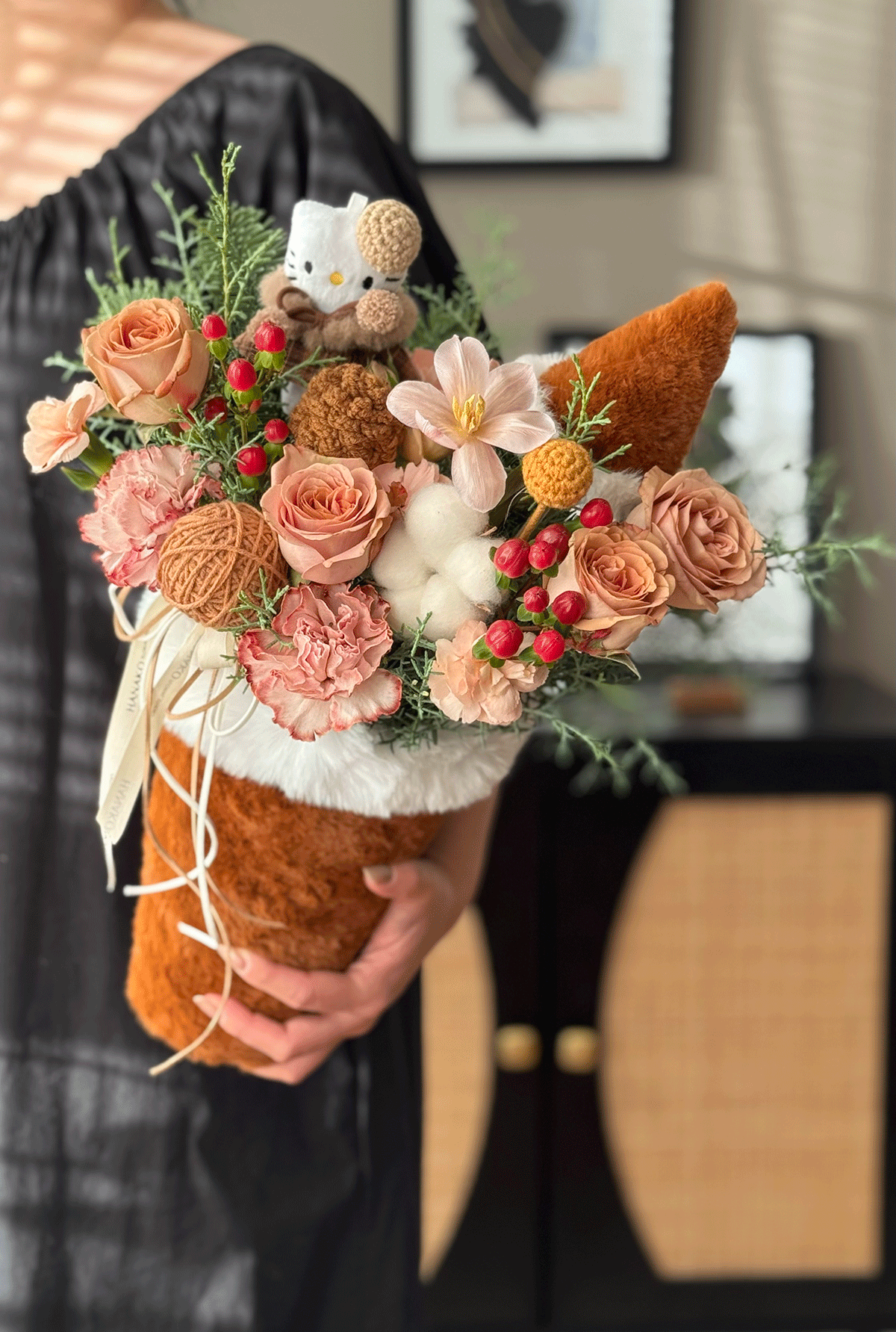 A cozy, heart-melting arrangement designed in a plush milk-tea cup holder—filled with fresh blooms, soft textures, and adorable handmade details.
