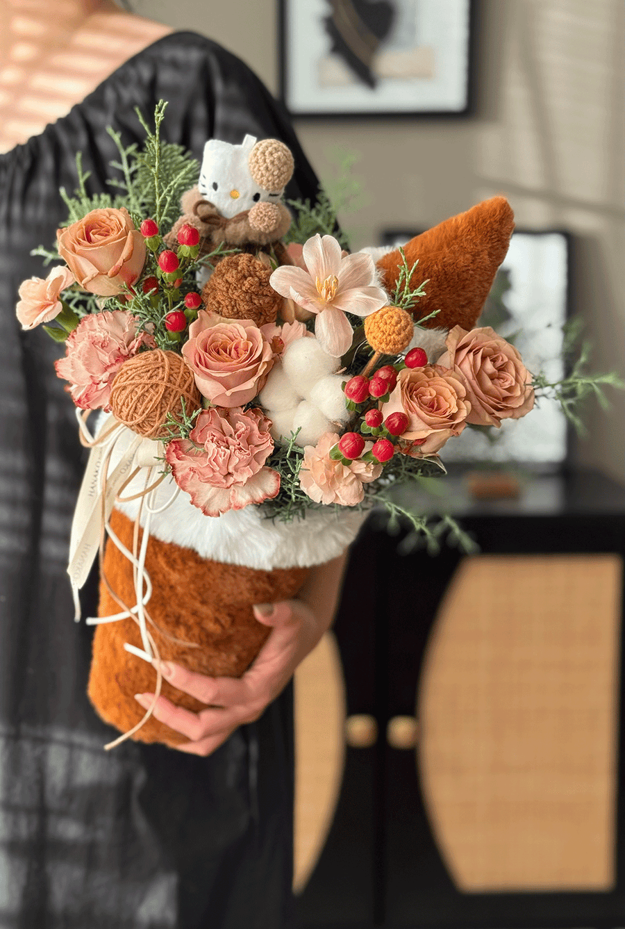 A cozy, heart-melting arrangement designed in a plush milk-tea cup holder—filled with fresh blooms, soft textures, and adorable handmade details.